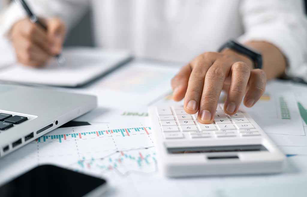 Man using a calculator