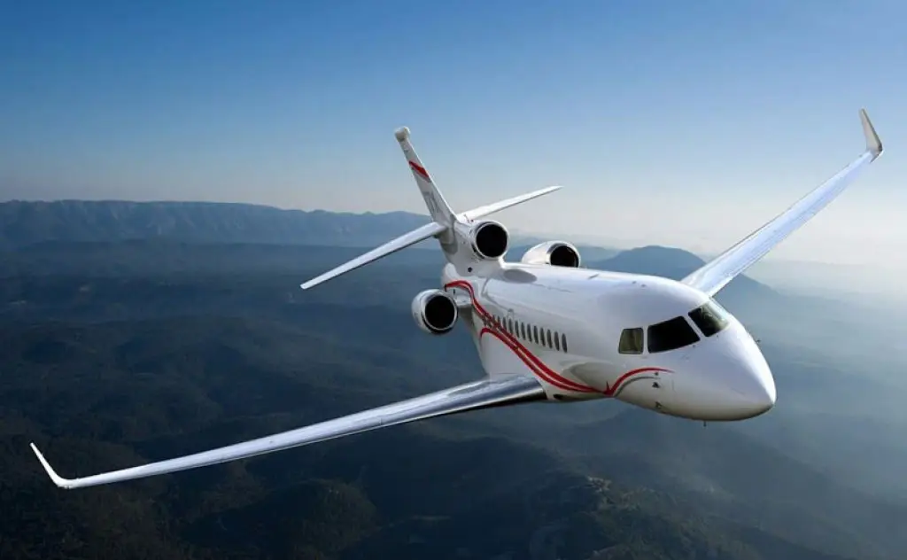 A Dassault Falcon 7X private jet in the air